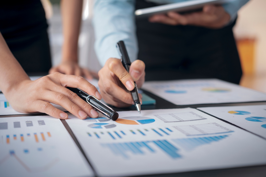 Analysts reviewing market data and charts